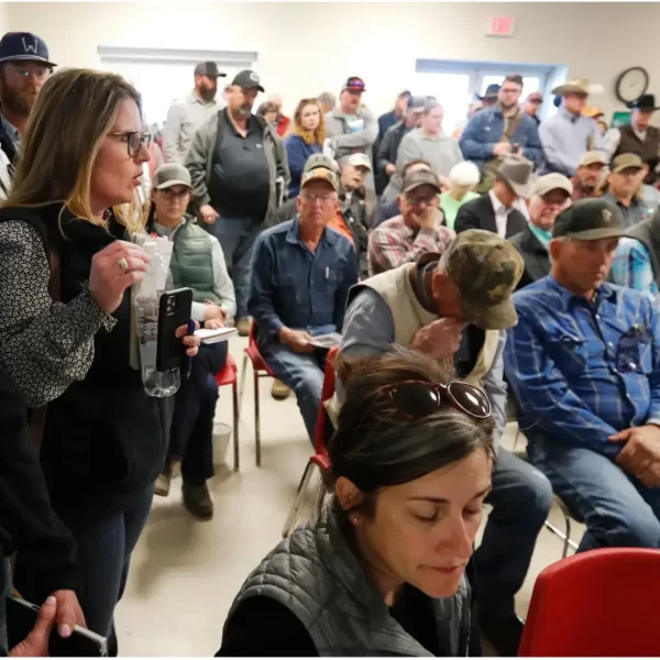 Christy Oats, left, talks at a U.S. Department of Agriculture informational meeting for farmers and ranchers affected by the Panhandle wildfires at the Hemphill County Exhibition Center in Canadian on March 5. Credit: Mark Rogers for The Texas Tribune